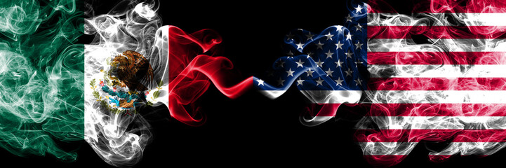 Mexico vs United States of America, American smoky mystic flags placed side by side. Thick colored silky abstract smokes banner of Mexican and United States of America, American