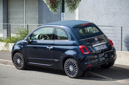 Navy Blue fiat 500  parked in the street
