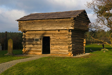 Obraz premium USA, WA, Whidbey Island, Fort Ebey State Park. Sunnyside Cemetary part of Ebey's Landing National HIstorical Reserve. Block house used by pioneers for defense