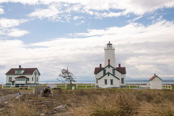 Fototapeta na wymiar USA, Washington State. Dungeness Spit Lighthouse on largest sand spit in US which is wildlife refuge.