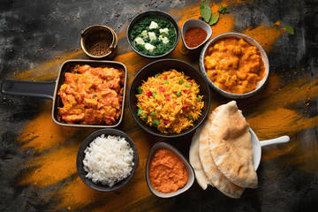 Assorted indian food on black background..