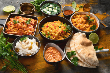 Assorted indian food on black background..