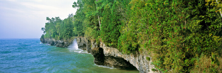 USA, Wisconsin, Door Co. Waves break against the cliffs of Cave Point County Park, in Door County, Wisconsin.