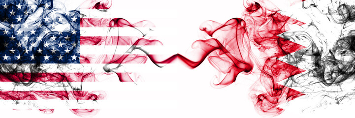 United States of America vs Bahrain, Bahrani smoky mystic flags placed side by side. Thick colored silky abstract smokes banner of America and Bahrain, Bahrani