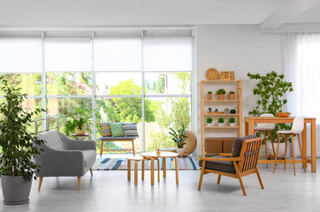 Modern living room interior with comfortable couch and wooden furniture