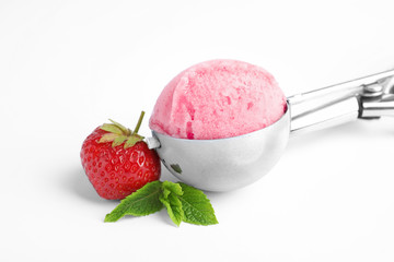 Scoop with delicious strawberry ice cream, mint and fresh berry on white background