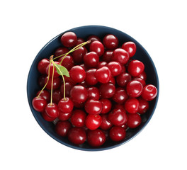Blue ceramic bowl of delicious ripe sweet cherries on white background, top view