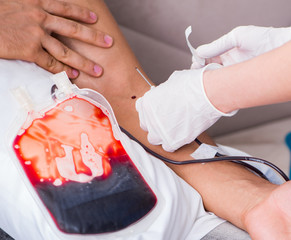 Patient getting blood transfusion in hospital clinic
