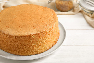 Delicious fresh homemade cake on white wooden table