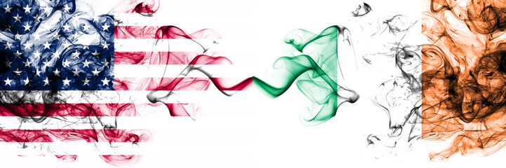 United States of America vs Ireland, Irish smoky mystic flags placed side by side. Thick colored silky abstract smokes banner of America and Ireland, Irish