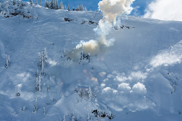 Explosive hand charge to trigger and control avalanche at Grand Targhee Ski Resort