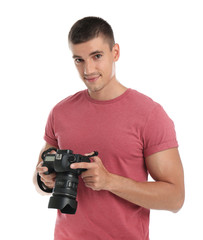 Young photographer with professional camera on white background