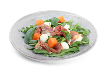 Fresh melon with prosciutto, mozzarella and arugula on white background