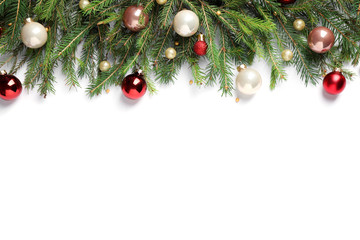 Naklejka na ściany i meble Fir branches with Christmas decorations on white background, flat lay