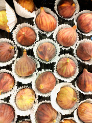 Ripe figs in beautiful containers. Natural organic food for a healthy diet.