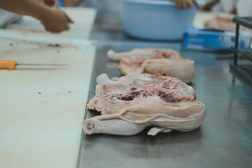chicken processing in factory. poultry production in food industry