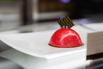 One delicious red cake with fresh berries.