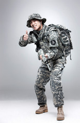 Armed soldier holding a rifle.