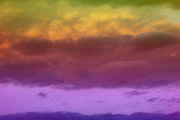 Obraz premium lovely unreal vivid fantasy sun colored cloudy sky for using in design as background.