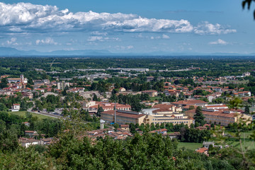 Fototapeta na wymiar Aviano di Pordenone, con il Duomo di San Zenone ed il centro abitato, panorama aereo