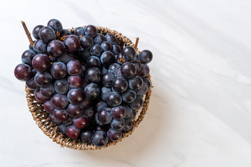 fresh black grapes on white background