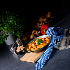 a delicious fried potato and shrimp pan