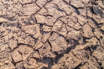 Close-up Dry Soil on the ground under sunny day, Sam Phan Bok, Ubon Ratchathani, Thailand.