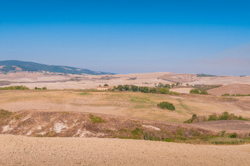 Fototapeta na wymiar Countryside landscape with barren fields and dry soil