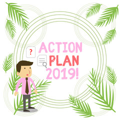 Writing note showing Action Plan 2019. Business concept for proposed strategy or course of actions for current year Young Male Businessman Worker Searching Problem Solution