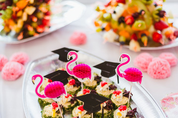 party platter decorated with flamingos and graduation caps