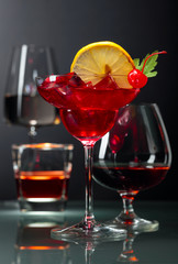 Various alcoholic drinks on a black background.