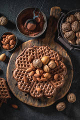 Homemade and fresh waffles with dark chocolate and almonds