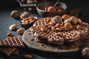 Closeup of homemade waffles with dark chocolate and nuts