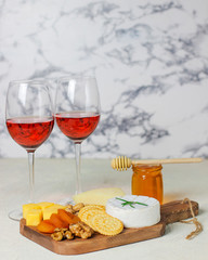 cheese plate,camembert cheese ,rosemary ,crackers,dry apricot and walnuts