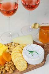 cheese plate,camembert cheese ,rosemary ,crackers,dry apricot and walnuts