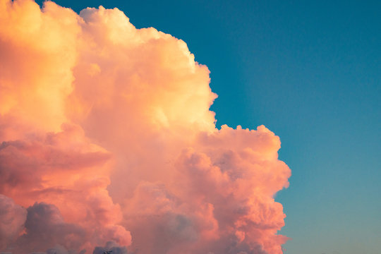 Pink Clouds At Sunset Against A Blue Sky