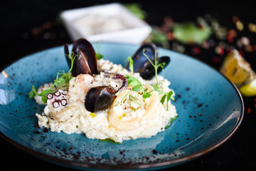 risotto with fresh seafood & shrimps, shells, octopus, calamari 
