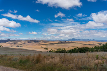 Vast South African countryside landscape with dry grass and hills