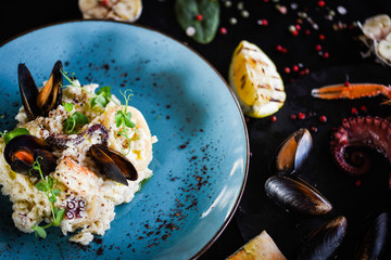 risotto with fresh seafood & shrimps, shells, octopus, calamari 