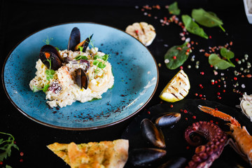 risotto with fresh seafood & shrimps, shells, octopus, calamari 