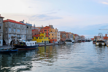 Obraz premium Chioggia, Italy - July, 16, 2019: Landscape with the image of channel in Chioggia, Italy