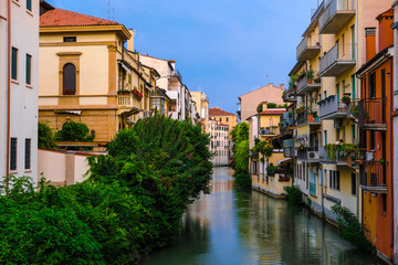Fototapeta na wymiar Padova, Italy - July, 27, 2019: Landscape with the image of channel in Padova, Italy