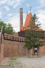 A fragment of the defensive walls with a tower built around 1285 using the opus emplectum technique. Opole, Poland, Europe.
