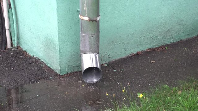 Rain water running through downpipe