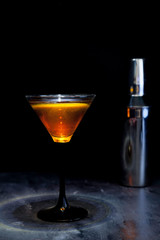 red cocktail and cocktail shaker