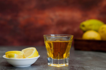 tequila shot with lemon slice