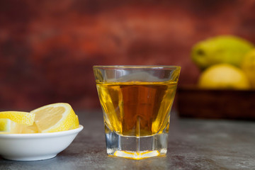 tequila shot with lemon slice close-up