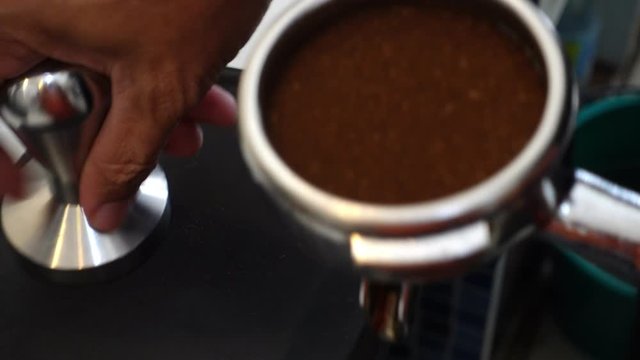 The process of making coffee : tamping coffee footage video 4k.