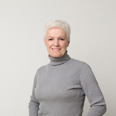 Portrait of attractive elderly woman smiling at camera