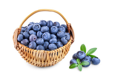 fresh ripe blueberry in wooden basket isolated on white background